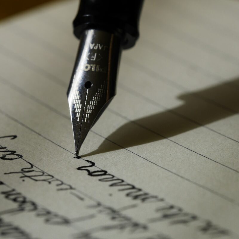A fountain pen writing a will.