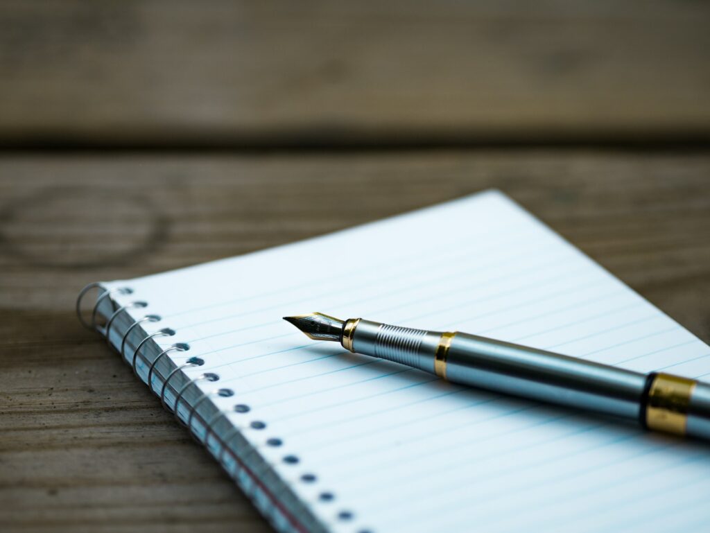 deed of variation, a notebook with an ink pen